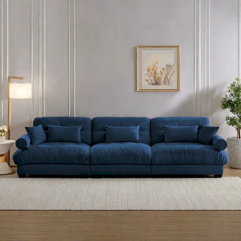 Canapé modulable en velours avec coussin nuage et appuie-têtes cylindriques