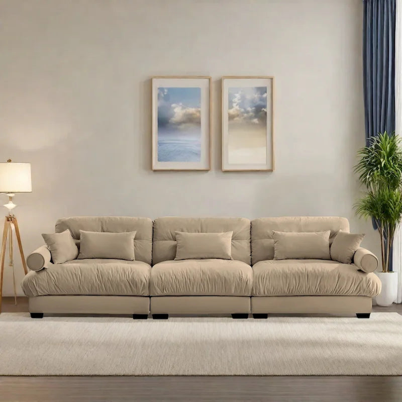 Canapé modulable en velours avec coussin nuage et appuie-têtes cylindriques