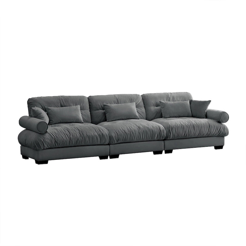 Canapé modulable en velours avec coussin nuage et appuie-têtes cylindriques