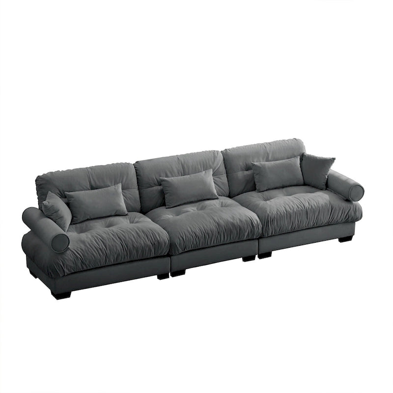Canapé modulable en velours avec coussin nuage et appuie-têtes cylindriques