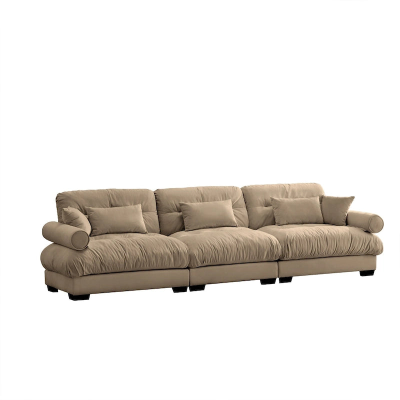 Canapé modulable en velours avec coussin nuage et appuie-têtes cylindriques