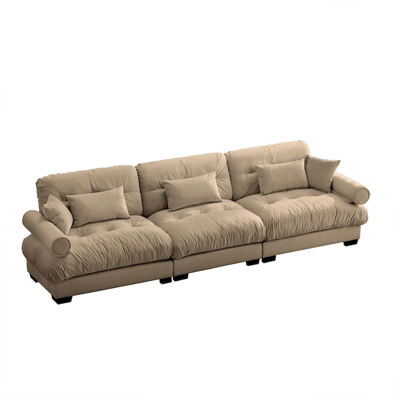 Canapé modulable en velours avec coussin nuage et appuie-têtes cylindriques