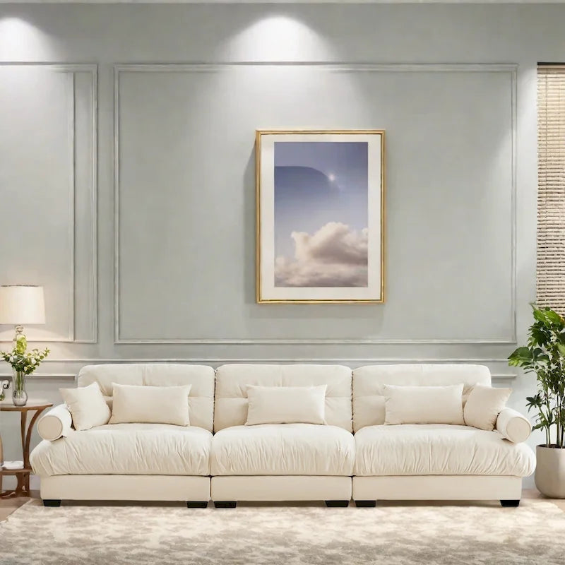 Canapé modulable en velours avec coussin nuage et appuie-têtes cylindriques