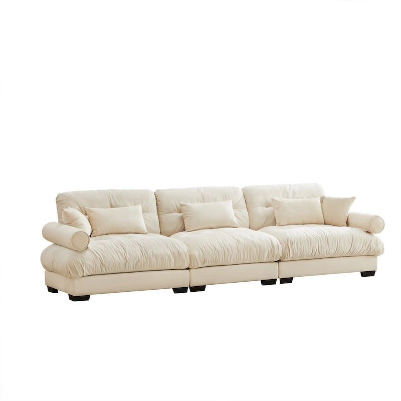 Canapé modulable en velours avec coussin nuage et appuie-têtes cylindriques