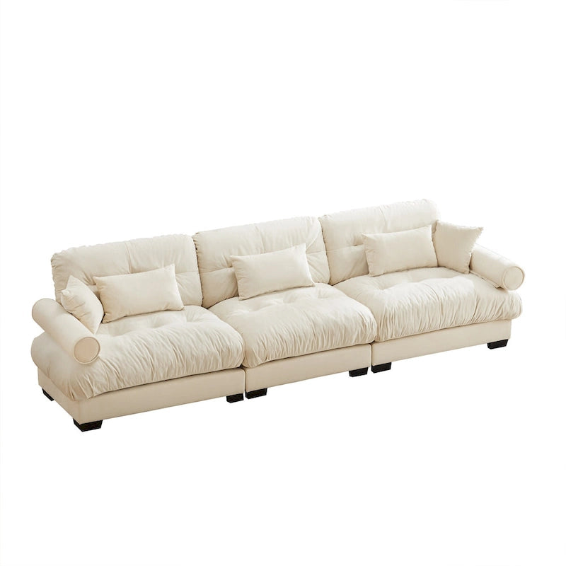 Canapé modulable en velours avec coussin nuage et appuie-têtes cylindriques