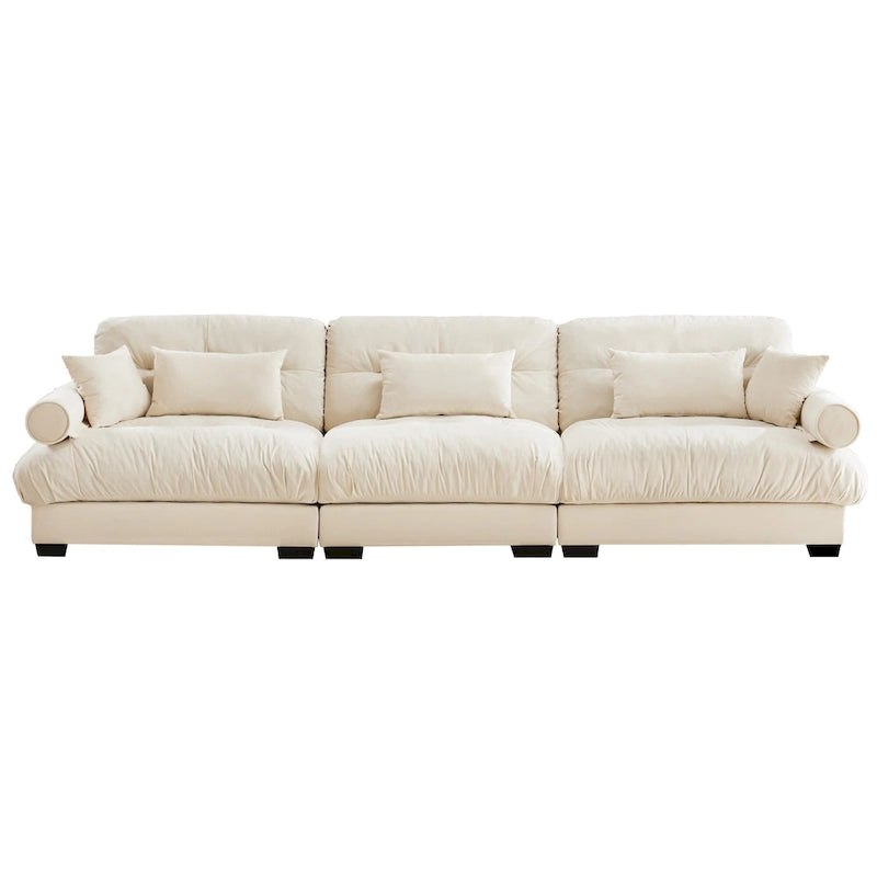 Canapé modulable en velours avec coussin nuage et appuie-têtes cylindriques