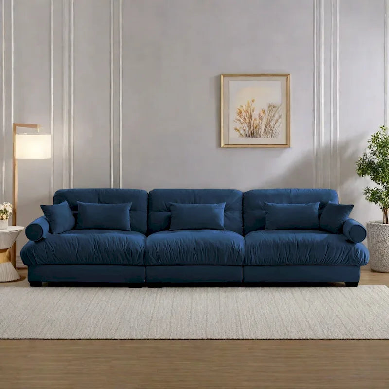 Canapé modulable en velours avec coussin nuage et appuie-têtes cylindriques