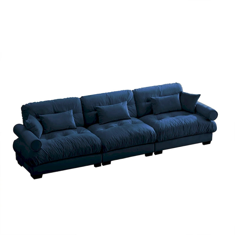 Canapé modulable en velours avec coussin nuage et appuie-têtes cylindriques