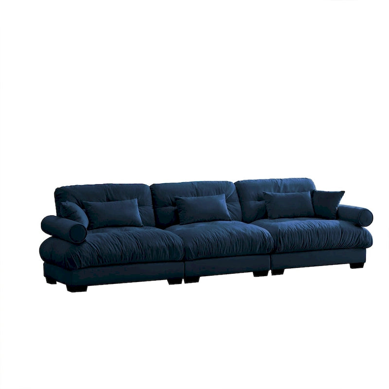 Canapé modulable en velours avec coussin nuage et appuie-têtes cylindriques