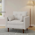 Fauteuil club capitonné avec coussins décoratifs