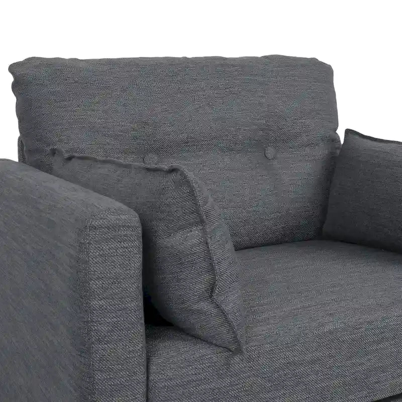 Fauteuil club capitonné avec coussins décoratifs